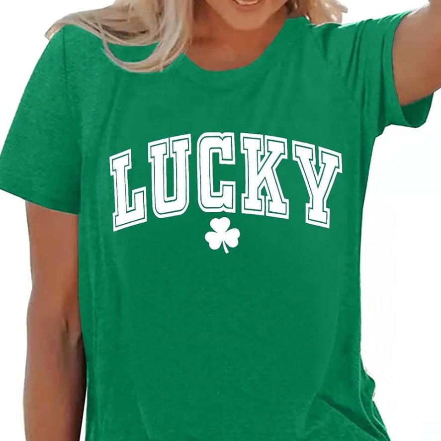 30edffdb-a001-4740-a0e9-d1445677b384jpg • Punkin's Patch Person wearing a green T-shirt that says 'LUCKY' with a white shamrock graphic below it.