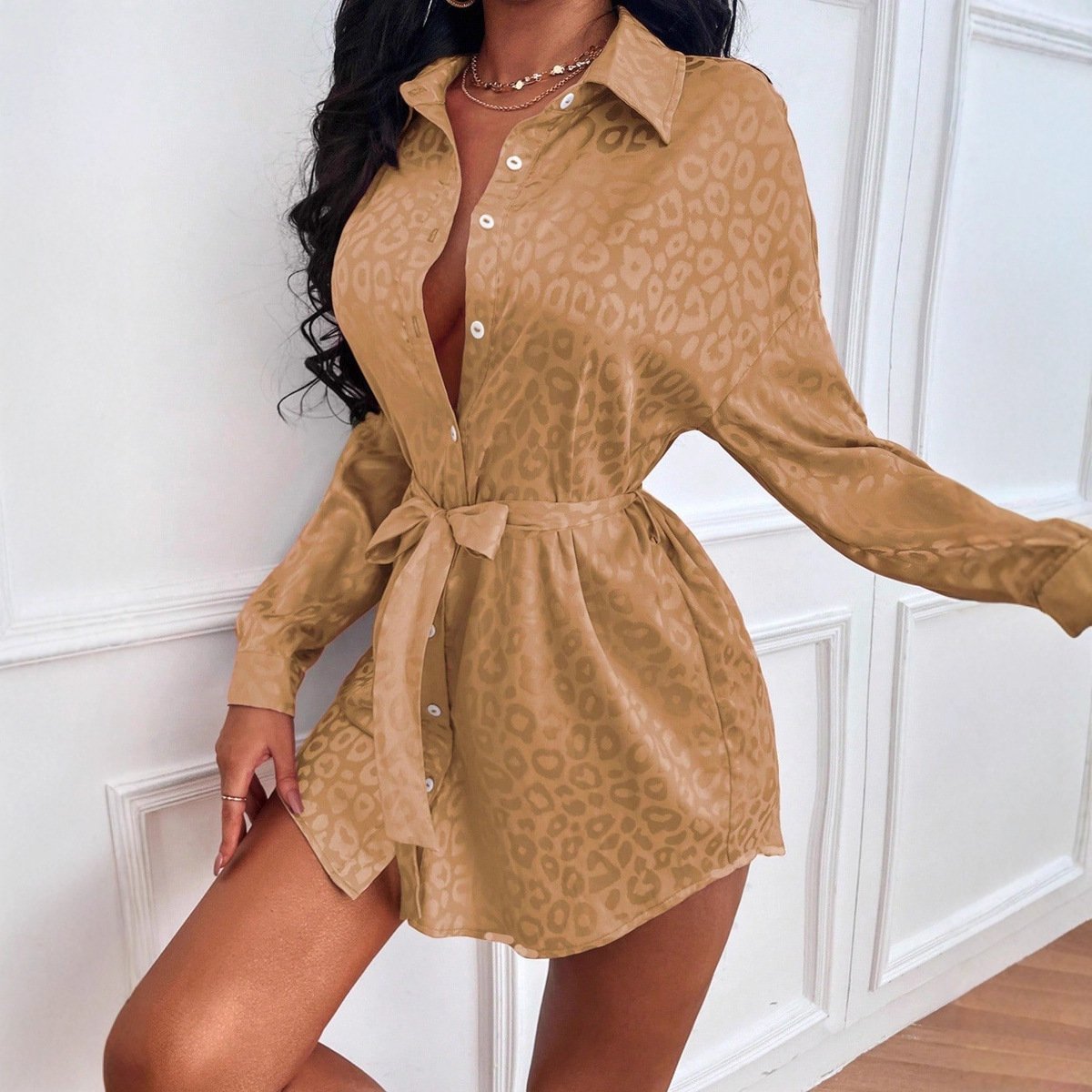 55eaa3bf-7302-447b-8aad-20d71aa5404fjpg • Punkin's Patch Tan leopard-print shirt dress with a waist belt and white buttons, posing indoors.