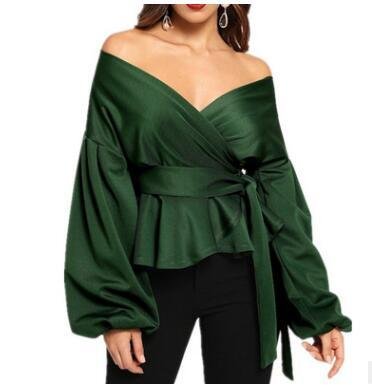 94feb3ab-13d9-47be-b2fe-937922ce2d0ajpg • Punkin's Patch Green satin off-the-shoulder peplum wrap top with long bishop sleeves and a waist tie.