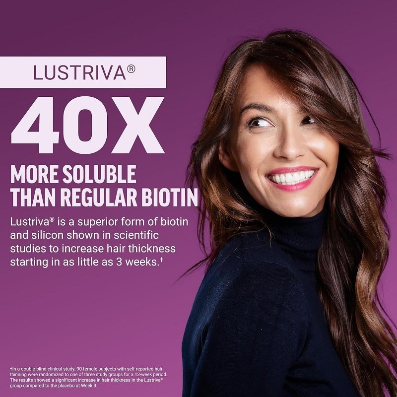 9b543c2b-af0b-4746-b6b0-b4001ab95d72jpg • Punkin's Patch Smiling woman with long hair on a purple background beside bold text promoting Lustriva 40X more soluble biotin.