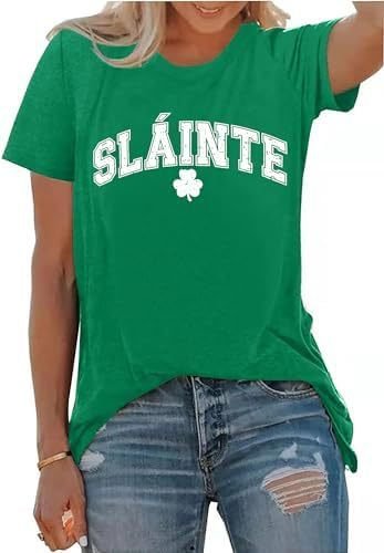 dbde3d41-b41a-40b7-93bc-25d93a8765b1jpg • Punkin's Patch Green T-shirt with 'SLÁINTE' and a shamrock, paired with distressed denim jeans.