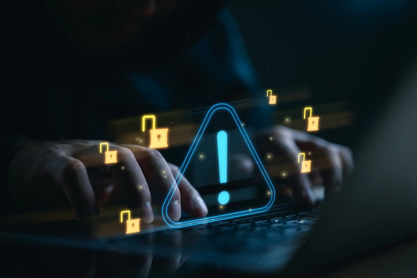 wp-header-logo-669png • Punkin's Patch Person typing on a keyboard with blue neon security-shaped hologram and floating yellow unlocked padlocks, symbolizing cybersecurity