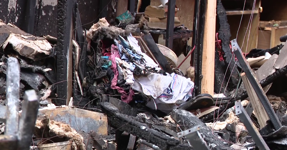 wp-header-logo-672png • Punkin's Patch Charred rubble and burned furniture with clothing piled among the debris from a fire-damaged interior