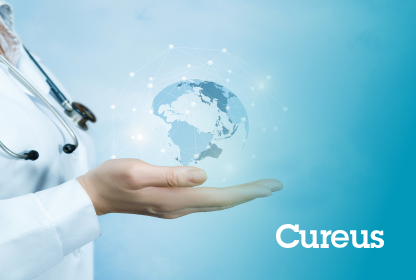 wp-header-logo-682png • Punkin's Patch Medical professional's hand holding a glowing globe connected by network lines, symbolizing global health; Cureus logo in the corner.