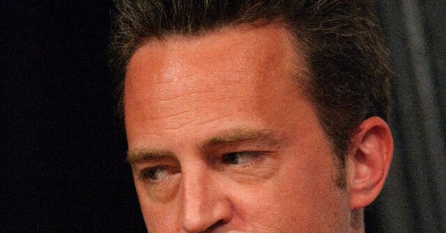 Close-up of a man’s face looking downward to the side.