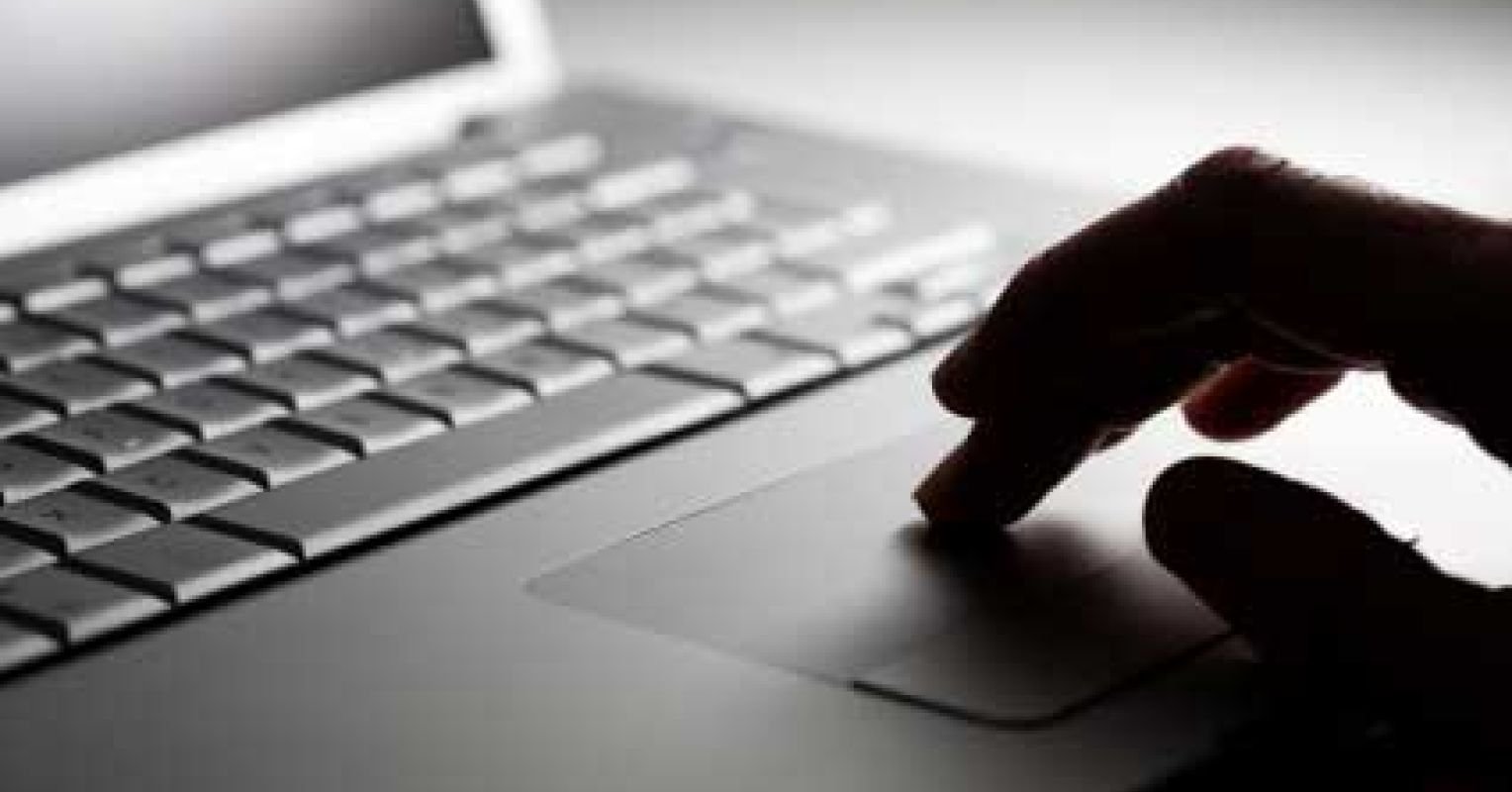 wp-header-logo-914png • Punkin's Patch Person's finger using a laptop touchpad next to a keyboard, close-up view of the input surface