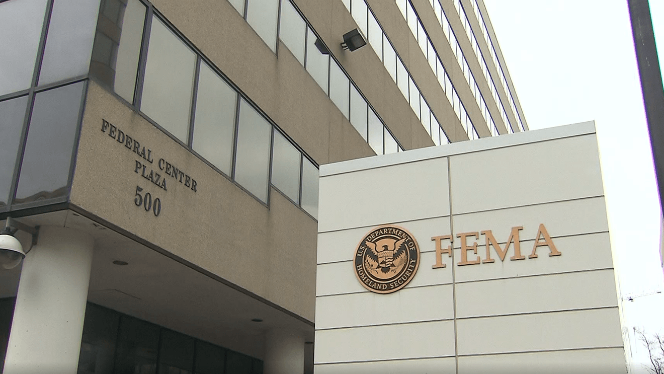 wp-header-logo-922png • Punkin's Patch Front view of a FEMA building with large sign reading 'FEMA' and the seal, and 'Federal Center Plaza 500' on the adjacent wall.